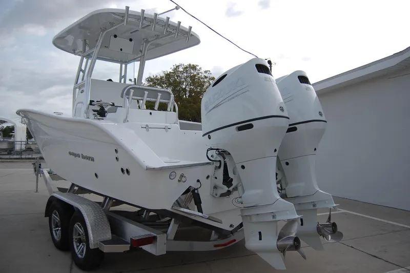 Slide: The Image of 2024 Cape Horn 24 XS boat with dual outboard engines on a trailer. - 6