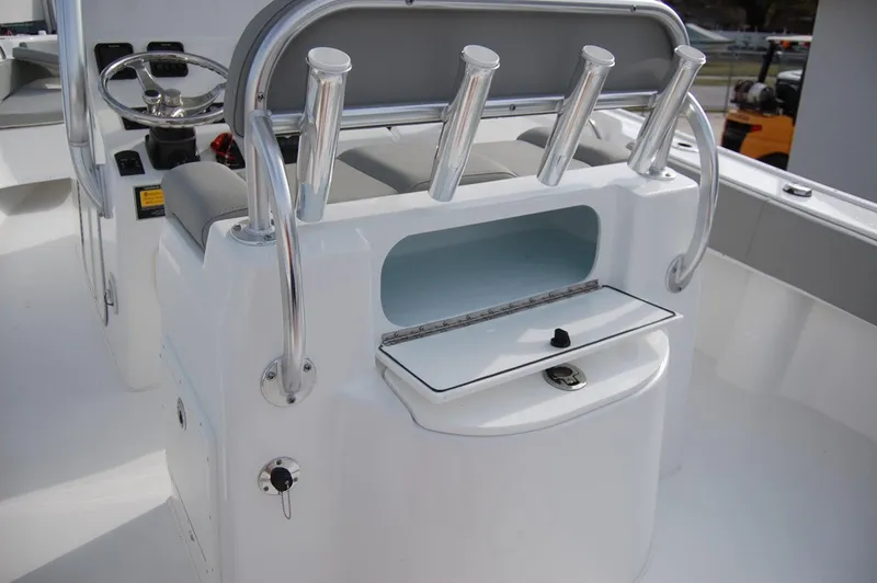 Slide: The Image of 2024 Cape Horn 24 XS boat console with rod holders and storage compartment. - 18