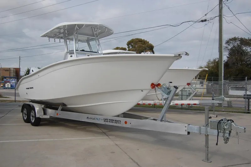Slide: The Image of 2024 Cape Horn 24 XS boat on a trailer in a parking lot. - 3