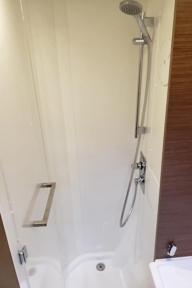 Slide: The Image of Shower area in 2019 Lagoon 40 yacht, featuring modern fixtures and sleek design. - 18