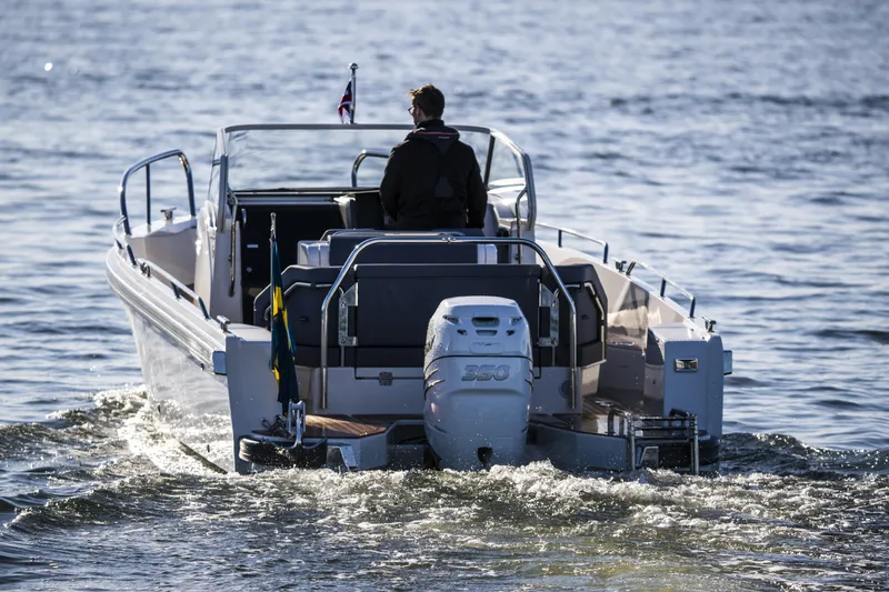 Slide: The Image of Nimbus T9 2025 motorboat cruising on open water. - 12