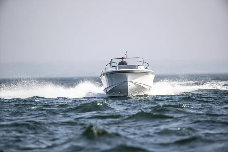 Slide: The Image of Nimbus T9 boat cruising on open water, 2025 model. - 8