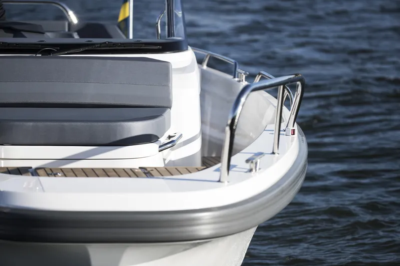 Slide: The Image of Nimbus T9 boat, 2025 model, close-up of seating and railing on water. - 6