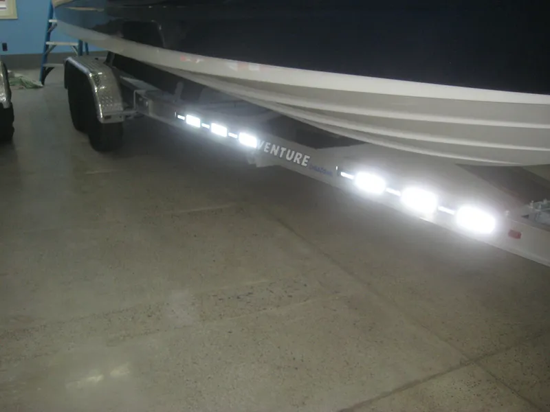 Slide: The Image of A 2013 Sea Ray 260 Sundeck on a trailer in a garage. - 26