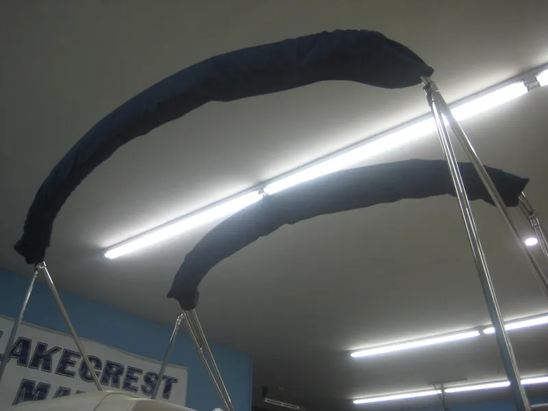Slide: The Image of Two curved metal bars with blue covers in an indoor setting. - 21