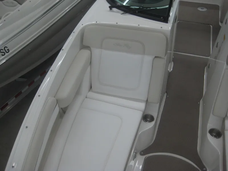 Slide: The Image of The image shows the interior of a 2013 Sea Ray 260 Sundeck boat with white upholstery. - 13
