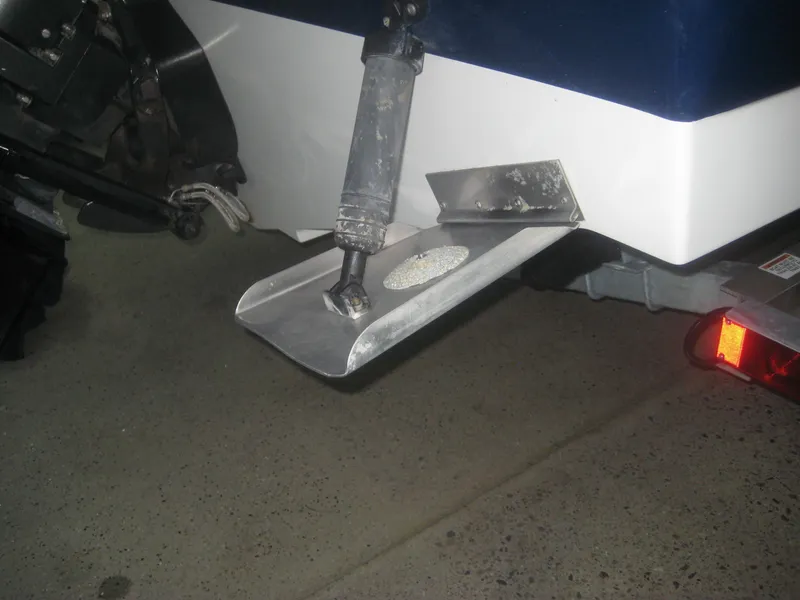 Slide: The Image of Close-up of a trim tab on a 2013 Sea Ray 260 Sundeck boat. - 24
