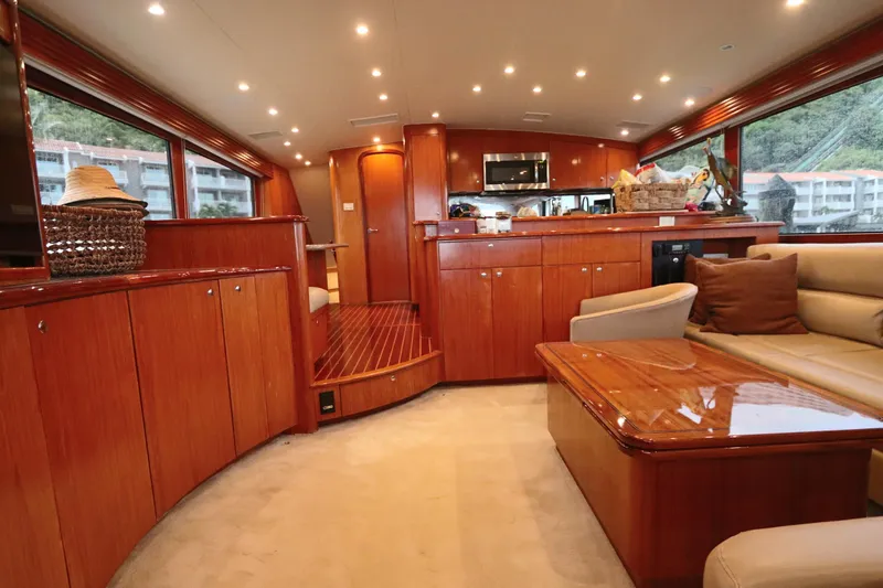 Slide: The Image of Luxurious interior of a 2002 Buddy Davis 74 yacht with elegant wood finishes and modern amenities. - 1