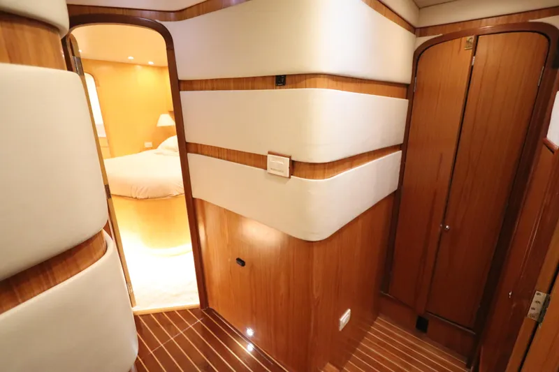 Slide: The Image of Luxurious interior of 2002 Buddy Davis 74 yacht with wood paneling and cozy bedroom. - 12