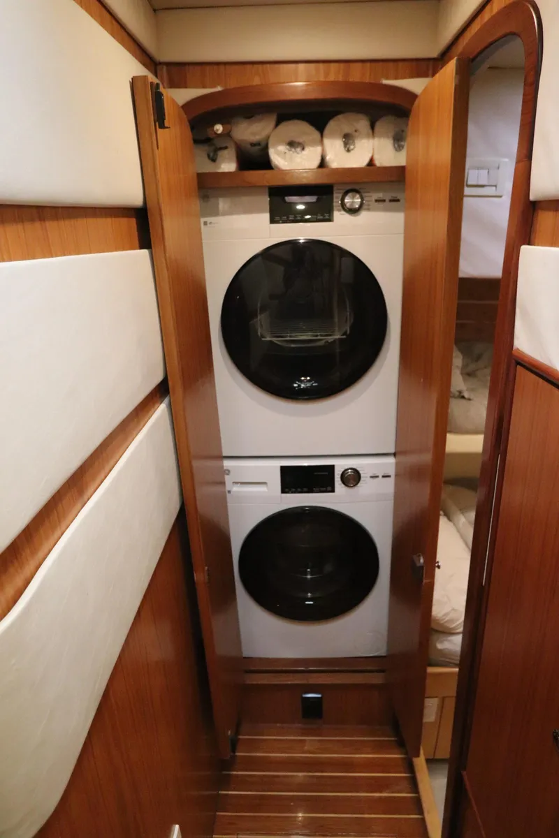 Slide: The Image of Laundry area with stacked washer and dryer in 2002 Buddy Davis 74 yacht. - 13