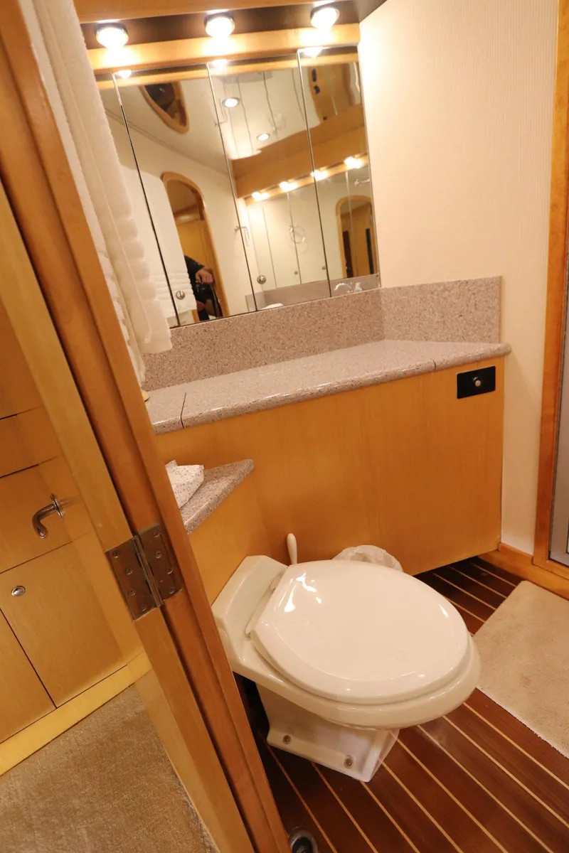 Slide: The Image of Luxurious bathroom in 2002 Buddy Davis 74 yacht with modern fixtures and wooden flooring. - 17