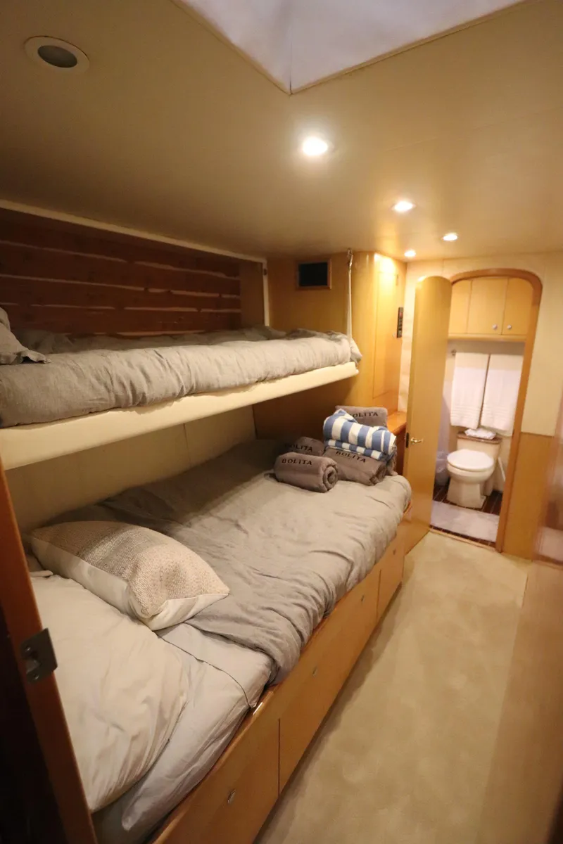 Slide: The Image of Interior of 2002 Buddy Davis 74 yacht with cozy bunk beds and bathroom. - 20