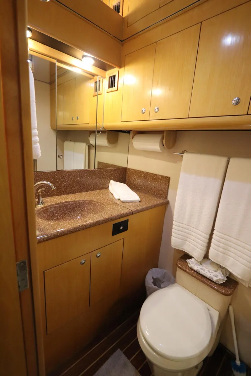 Slide: The Image of Luxurious bathroom in 2002 Buddy Davis 74 yacht with wooden cabinetry and modern fixtures. - 21