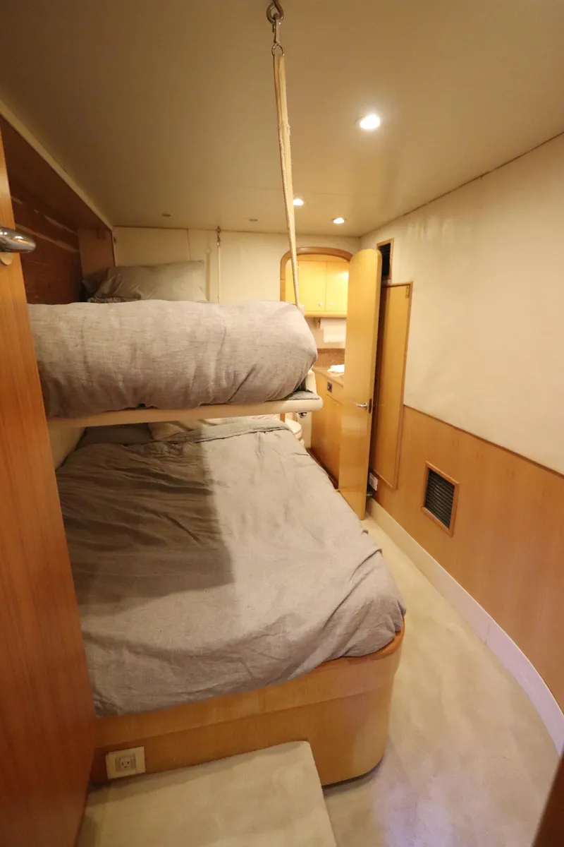 Slide: The Image of Interior of 2002 Buddy Davis 74 yacht with bunk beds and wooden cabinetry. - 22