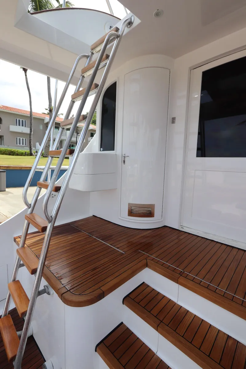 Slide: The Image of Staircase on 2002 Buddy Davis 74 yacht with wooden deck and sleek design. - 28