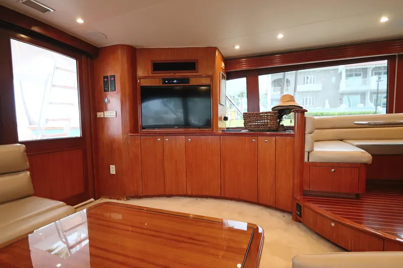 Slide: The Image of Luxurious interior of 2002 Buddy Davis 74 yacht with wood paneling and seating area. - 3