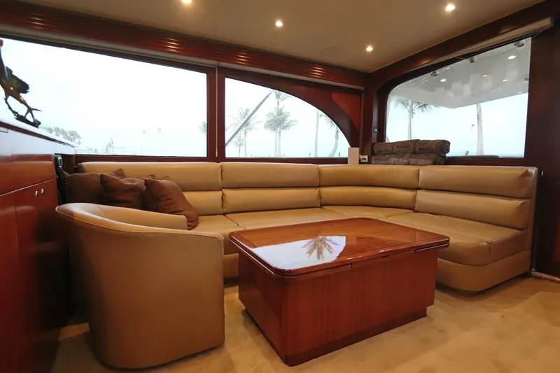 Slide: The Image of Luxurious interior of 2002 Buddy Davis 74 yacht with leather seating and wooden table. - 4