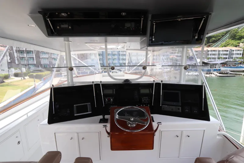 Slide: The Image of Helm of 2002 Buddy Davis 74 yacht with modern navigation equipment and panoramic view. - 42