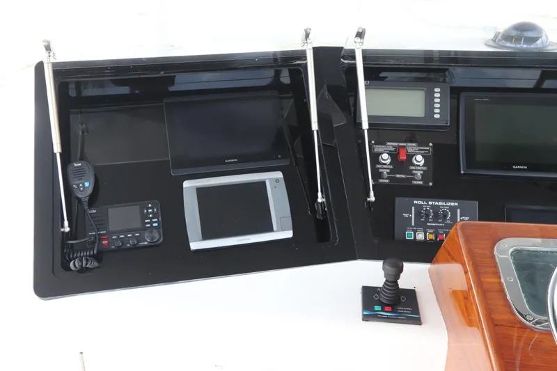 Slide: The Image of Control panel of a 2002 Buddy Davis 74 yacht with navigation and communication equipment. - 43