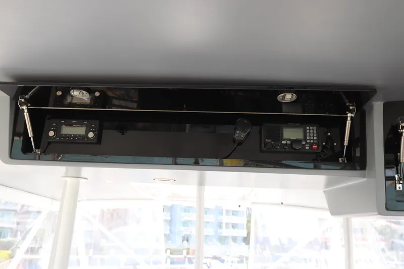 Slide: The Image of Overhead console with communication equipment on a 2002 Buddy Davis 74 yacht. - 47