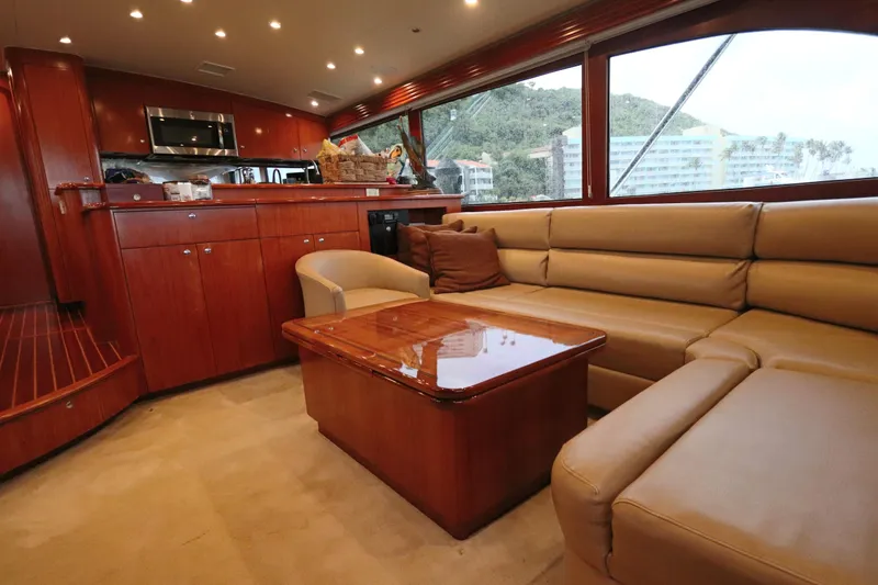 Slide: The Image of Luxurious interior of a 2002 Buddy Davis 74 yacht with leather seating and wooden cabinetry. - 5