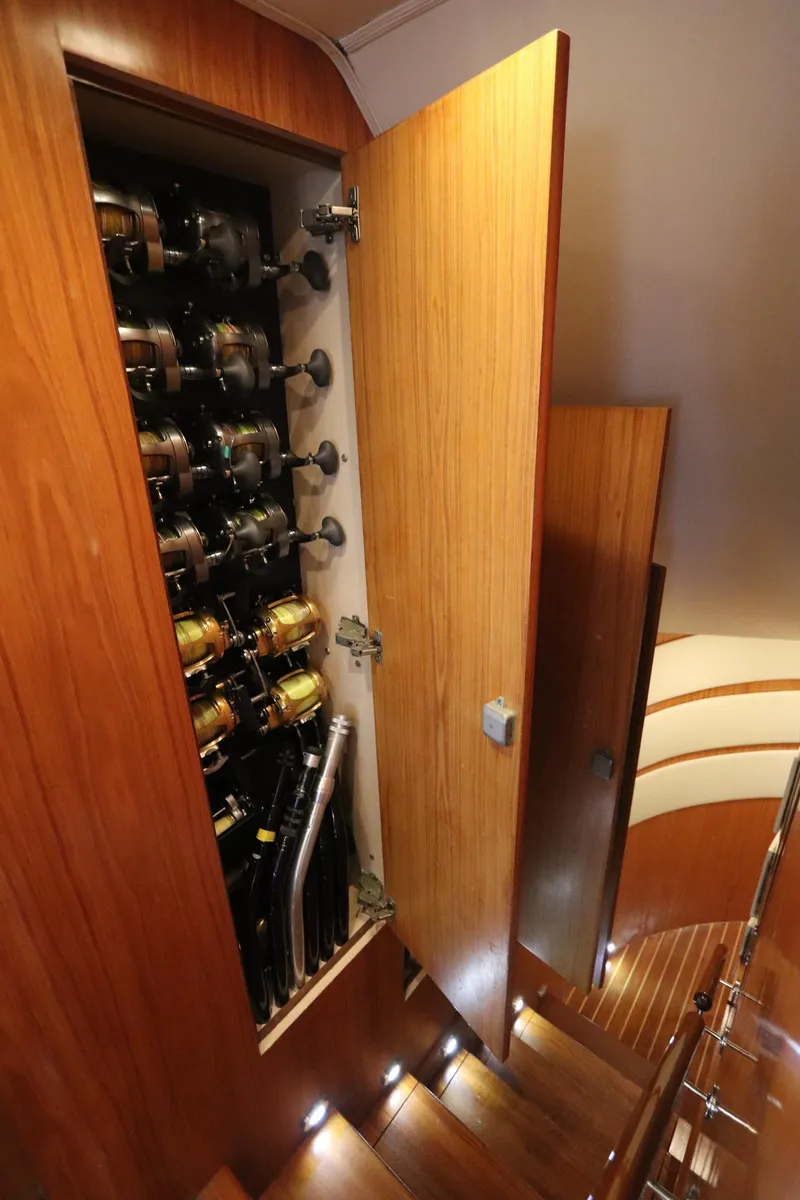 Slide: The Image of Interior view of 2002 Buddy Davis 74 yacht showing fishing rod storage cabinet. - 9