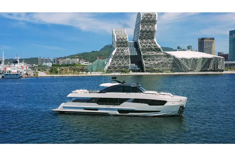 Slide: The Image of Luxury Ocean Alexander 30R yacht cruising near modern waterfront architecture, 2023 model. - 1