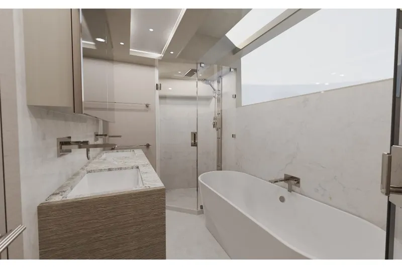 Slide: The Image of Modern bathroom in 2023 Ocean Alexander 30R yacht with bathtub and glass shower. - 12
