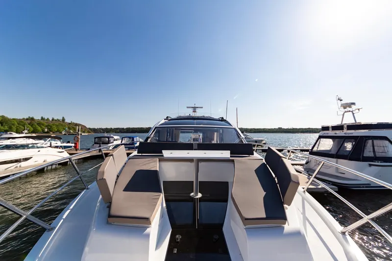 Slide: The Image of 2023 Galeon 470 Sky yacht docked at marina, front view. - 13