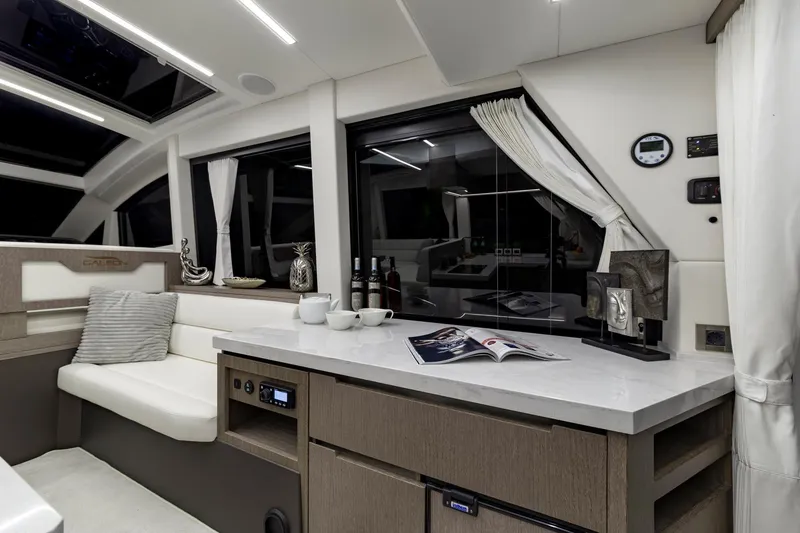 Slide: The Image of 2023 Galeon 470 Sky yacht interior with modern kitchen and seating area. - 22