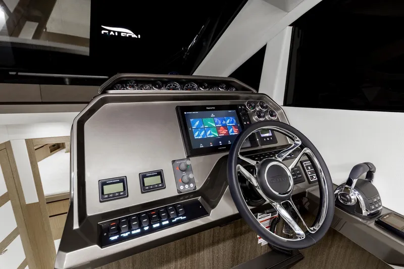 Slide: The Image of 2023 Galeon 470 Sky yacht helm with modern navigation controls and touchscreen display. - 24
