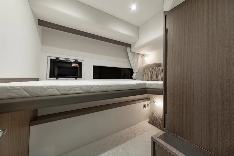 Slide: The Image of 2023 Galeon 470 Sky yacht interior cabin with modern design and cozy bedding. - 28