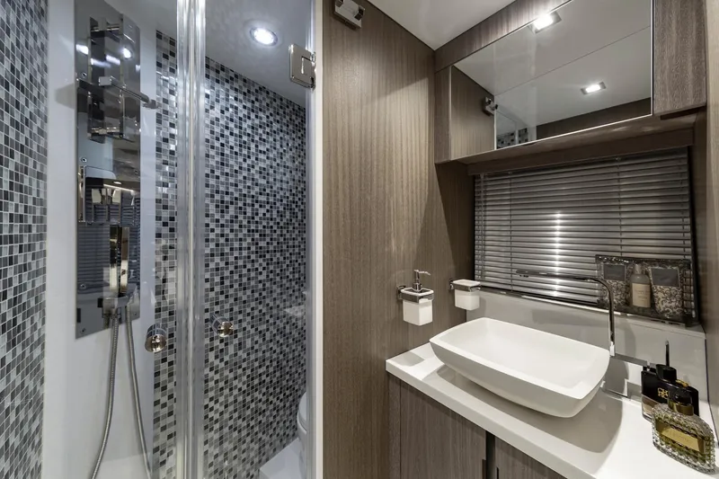 Slide: The Image of Modern bathroom in 2023 Galeon 470 Sky yacht with mosaic shower and sleek fixtures. - 32