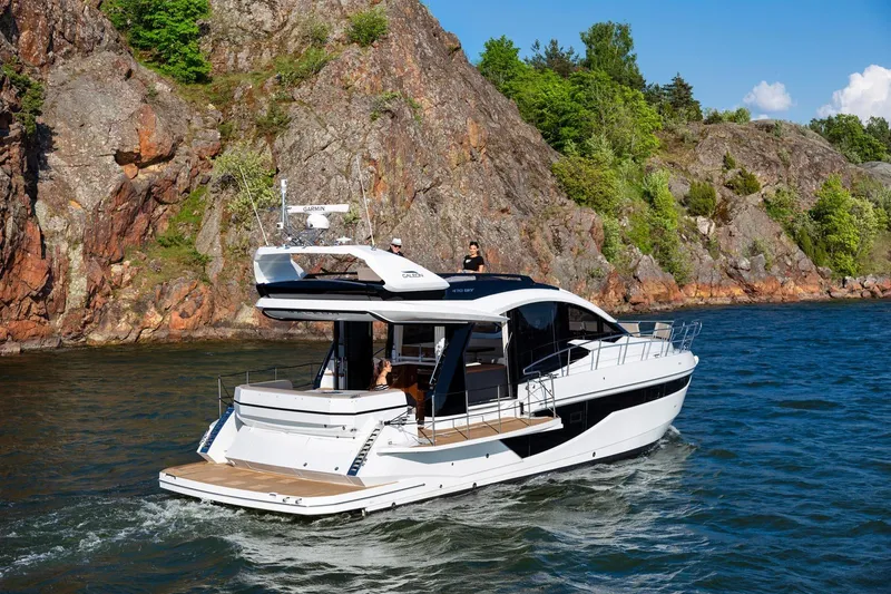 Slide: The Image of 2023 Galeon 470 Sky yacht cruising near rocky cliffs. - 7