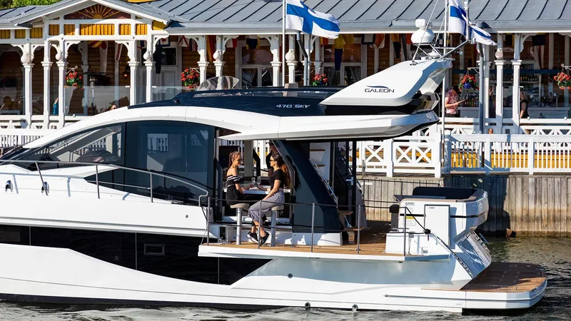 Slide: The Image of 2023 Galeon 470 Sky yacht docked with people on deck. - 9