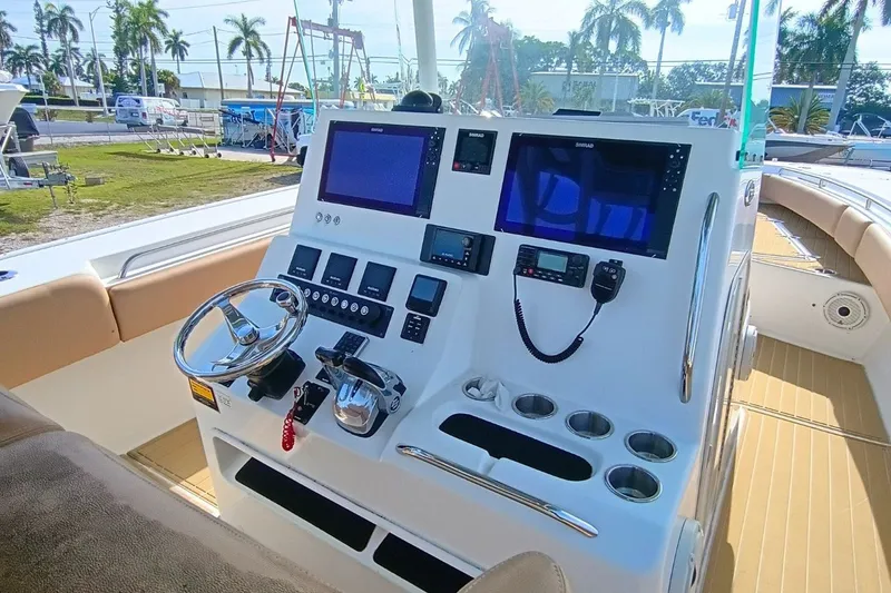 Slide: The Image of Helm of 2019 Cape Horn 36XS boat with advanced navigation equipment and controls. - 4