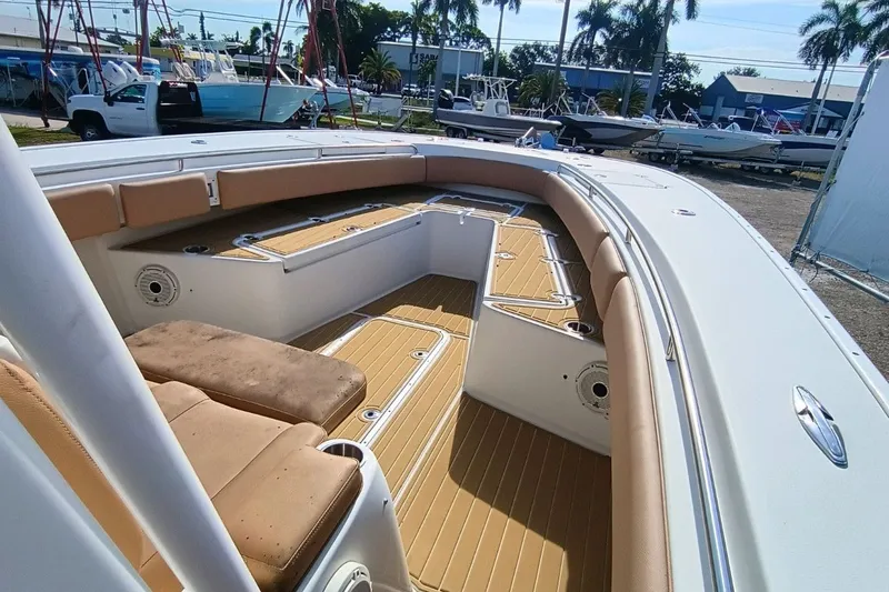 Slide: The Image of 2019 Cape Horn 36XS boat interior with tan seating and teak flooring. - 9