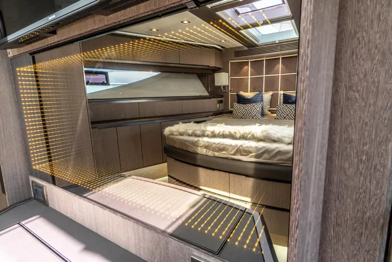Slide: The Image of Luxurious bedroom interior of 2023 Galeon 650 Sky yacht with modern design and ambient lighting. - 10