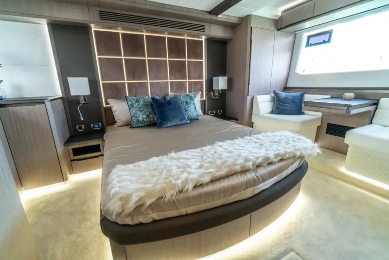 Slide: The Image of Luxurious bedroom interior of 2023 Galeon 650 Sky yacht with modern decor and ambient lighting. - 13
