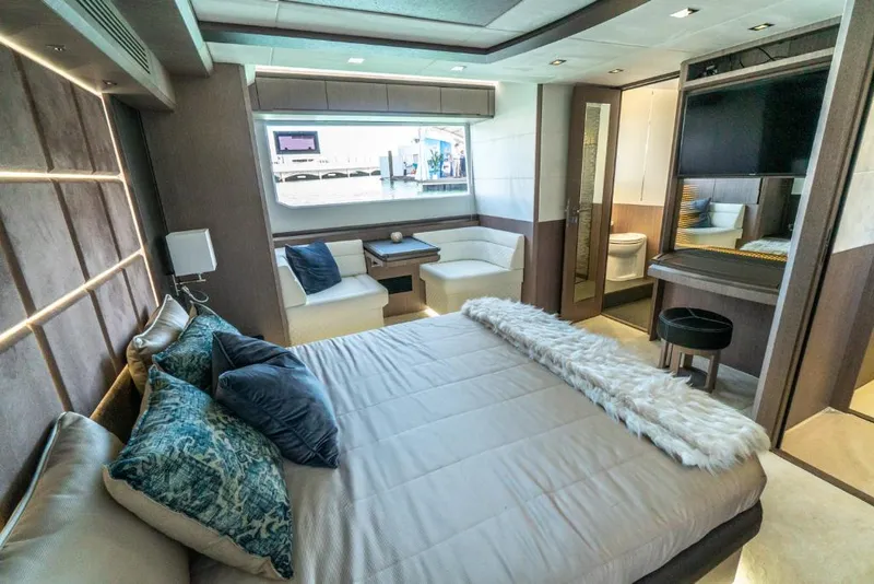 Slide: The Image of Luxurious bedroom interior of 2023 Galeon 650 Sky yacht with modern furnishings. - 14