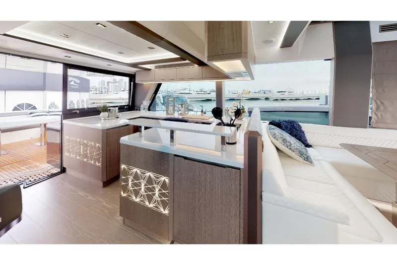 Slide: The Image of Modern interior of 2023 Galeon 650 Sky yacht with elegant kitchen and seating area. - 2