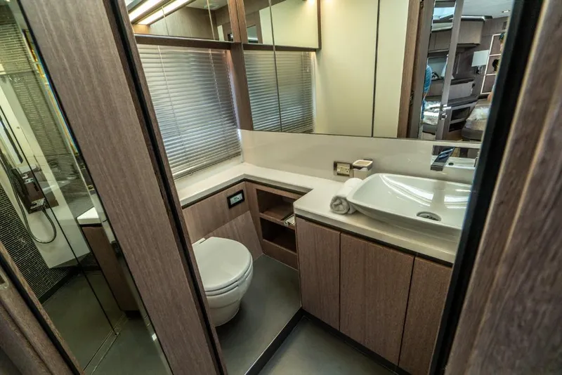 Slide: The Image of Modern bathroom in 2023 Galeon 650 Sky yacht with sleek fixtures and wooden cabinetry. - 20