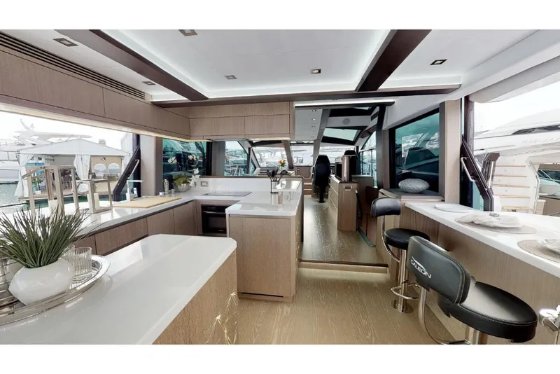 Slide: The Image of Luxurious interior of the 2023 Galeon 650 Sky yacht with modern furnishings and panoramic windows. - 5
