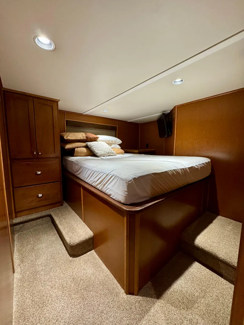 Slide: The Image of Carpeted stairs inside 2012 Bravada Helios Trip #7, featuring wooden walls. - 15