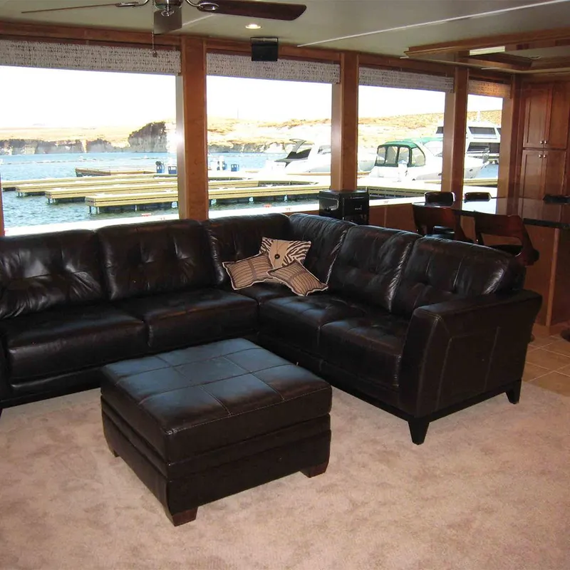 Slide: The Image of Interior of 2012 Bravada Helios Trip 7 with wooden finishes, TV, and ceiling fan. - 4