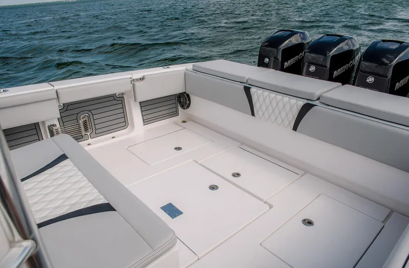Slide: The Image of 2025 Contender 39 Fisharound boat interior with seating and storage compartments. - 14