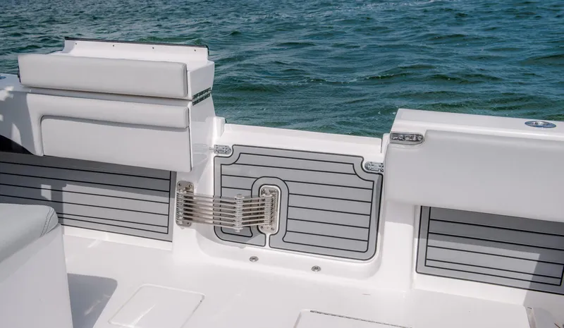 Slide: The Image of Contender 39 Fisharound 2025 boat interior with seating and water view. - 15