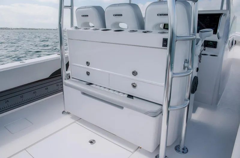 Slide: The Image of 2025 Contender 39 Fisharound boat interior with seating and storage compartments. - 19