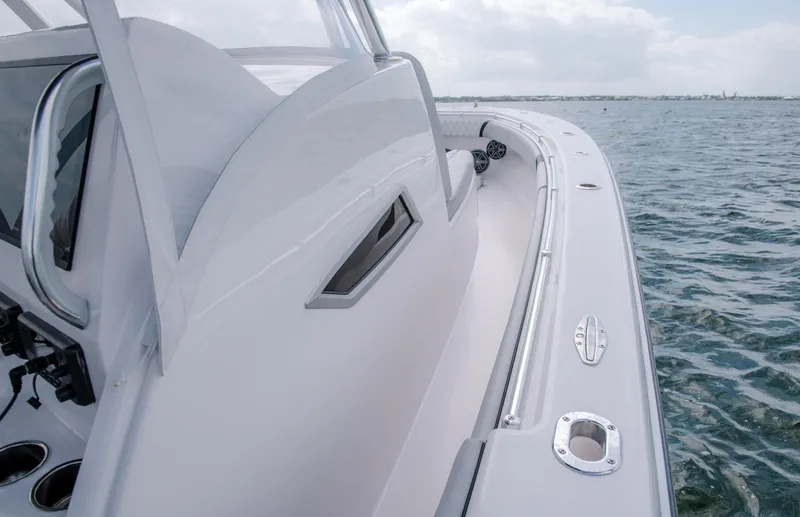 Slide: The Image of 2025 Contender 39 Fisharound boat on the water, showcasing sleek design and craftsmanship. - 3