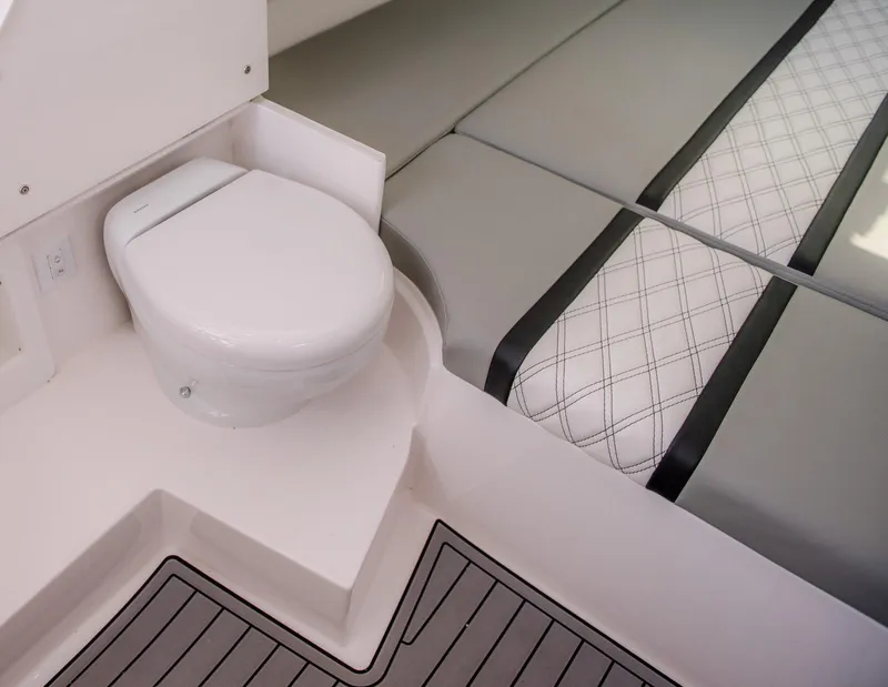 Slide: The Image of 2025 Contender 39 Fisharound interior with toilet and cushioned seating. - 30